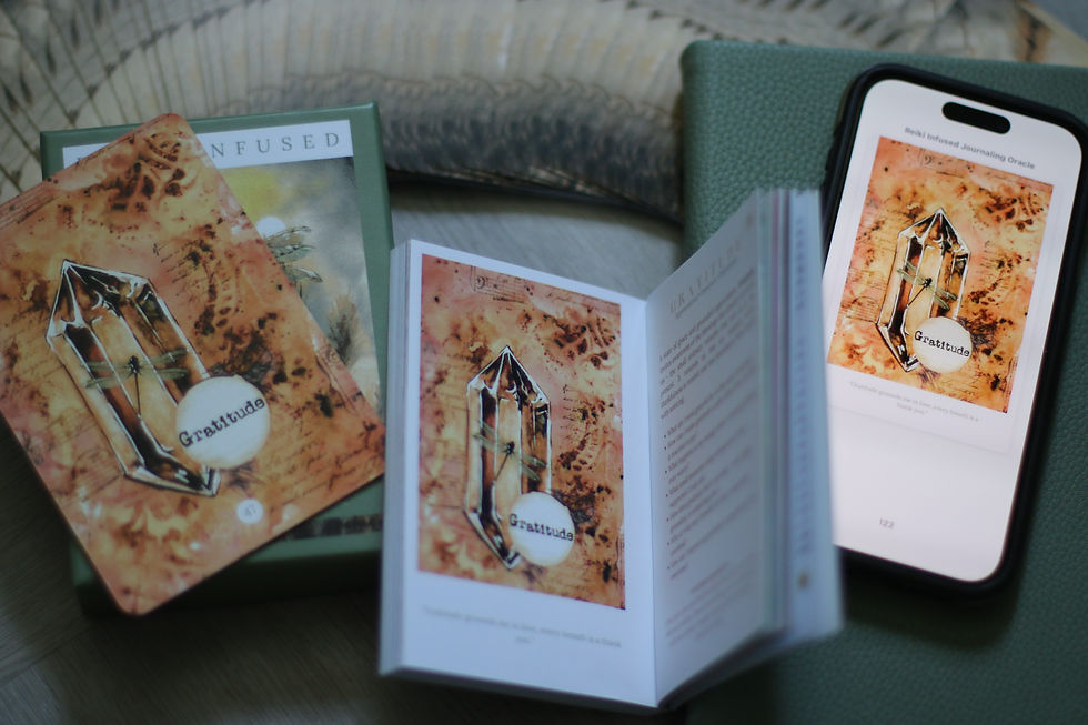 Image of oracle deck, pocket book and ebook open on the Gratitude card of the deck