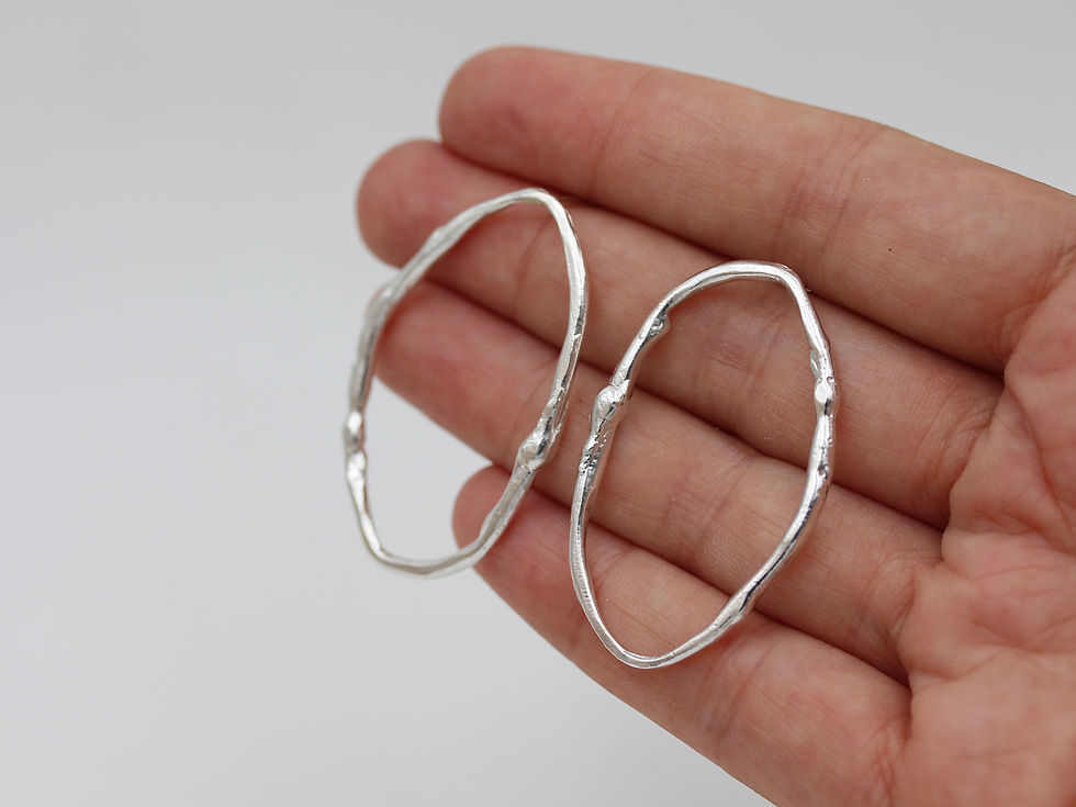 Thumbnail: Liquid oval earrings in sterling silver