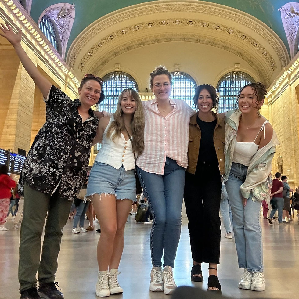 5 women standing and smiling inside of Grand Central Station in NYC