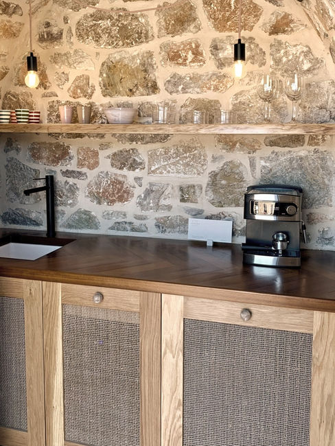 The mini-bar with coffee & tea making facilities, fridge, wine cooler and ceramic tableware