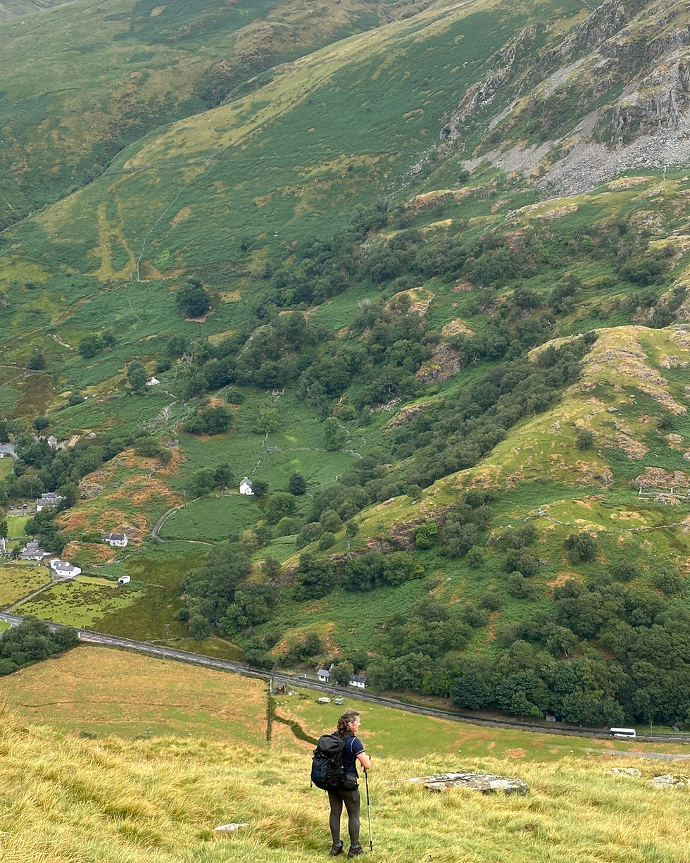 Anna looking back across Nant Peris during the climb towards Elidir Fawr on her Welsh 3000s journey.