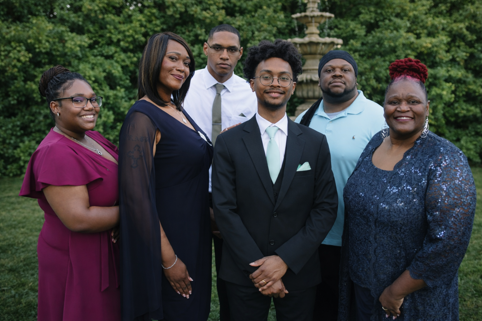 Family portrait of six adults outside