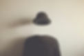 invisible man wearing black bowler, surreal concept of absence of identity.jpg