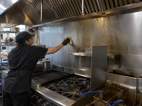 Commercial kitchen grease buildup on cooking surfaces and floors