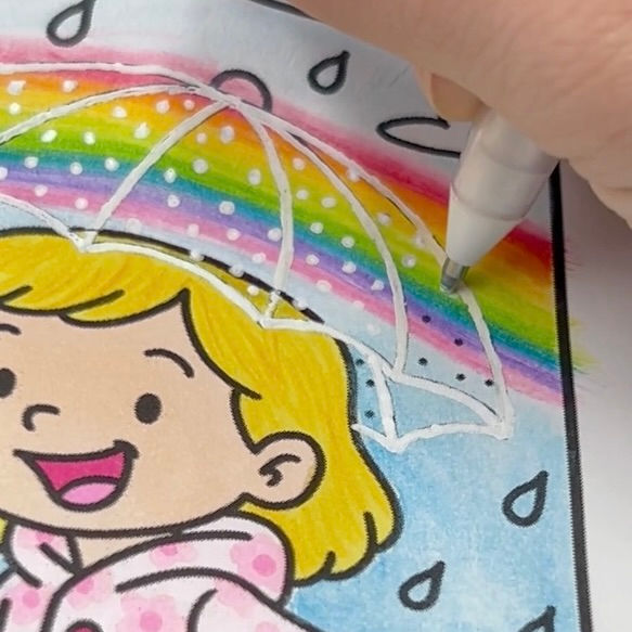 Step 4 for the clear umbrella coloring how-to. Shows adding polka dots to the umbrella with a white gel pen.