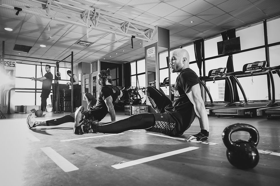 Man performing a plyometric floor leg thrust exercise