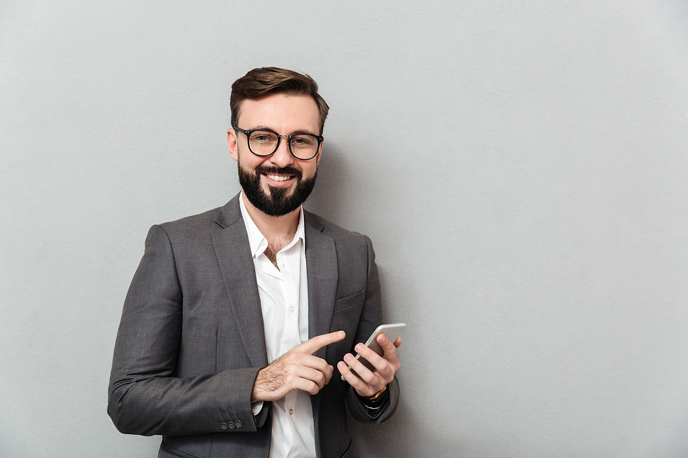 smiling-man-white-shirt-typing-text-message-scrolling-feed-social-network-using-smartphone