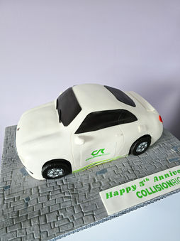White car cake with green and black accents, Happy 5th Anniversary Collision Co.