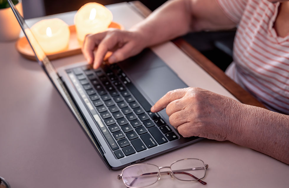 Retired woman uses laptop