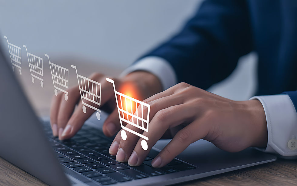 Hands typing on laptop with e-commerce shopping carts