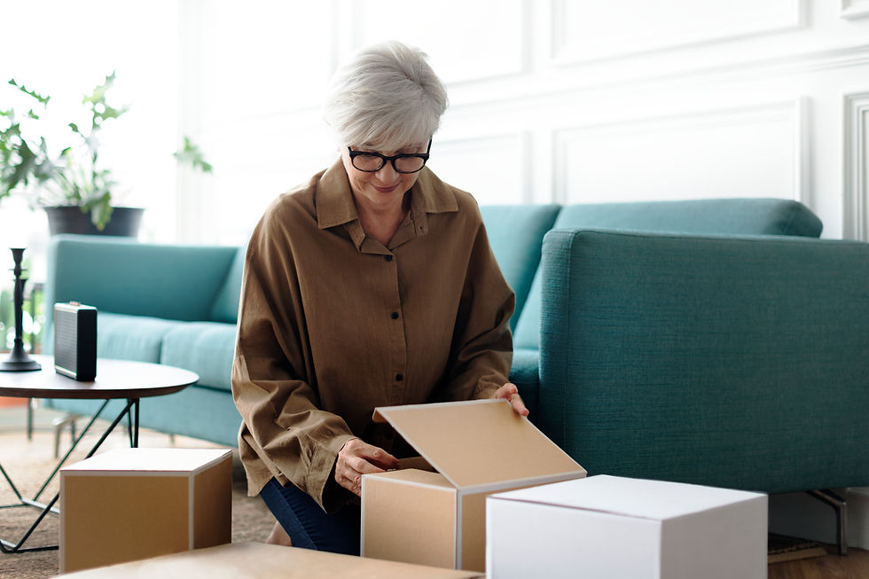 woman-unpacking-brown-boxes-living-room.jpg
