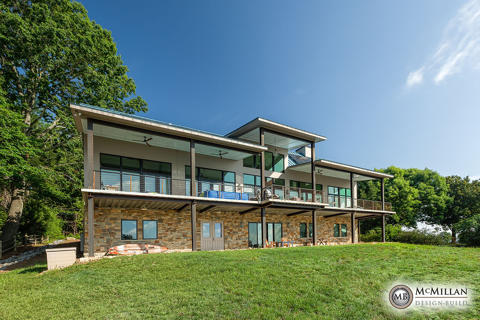 Modern two-story house with stone facade and large balcony