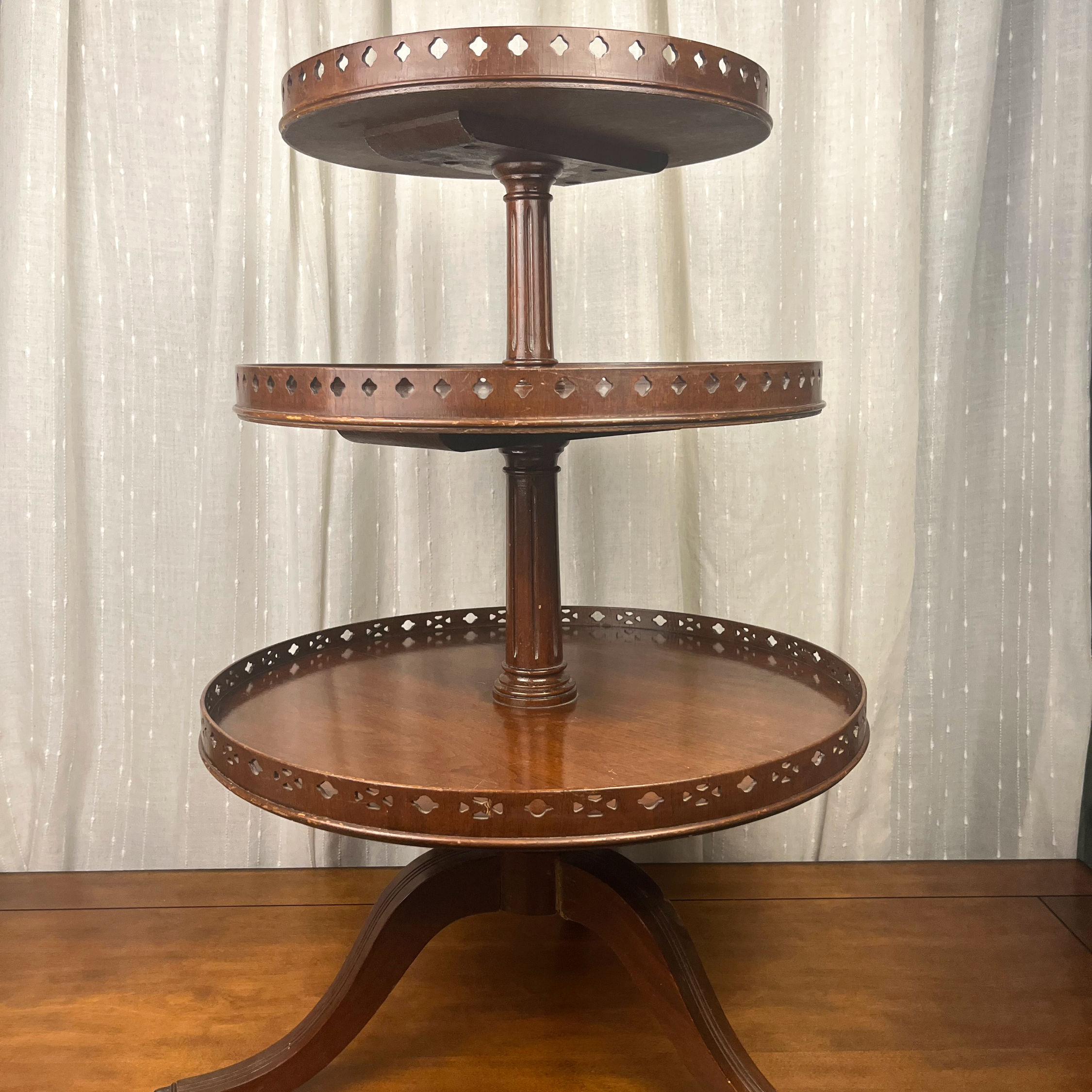 Three-Tiered Wooden Display Table with Brass Lion’s Feet