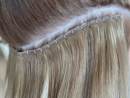 Hand sewn weft extensions
