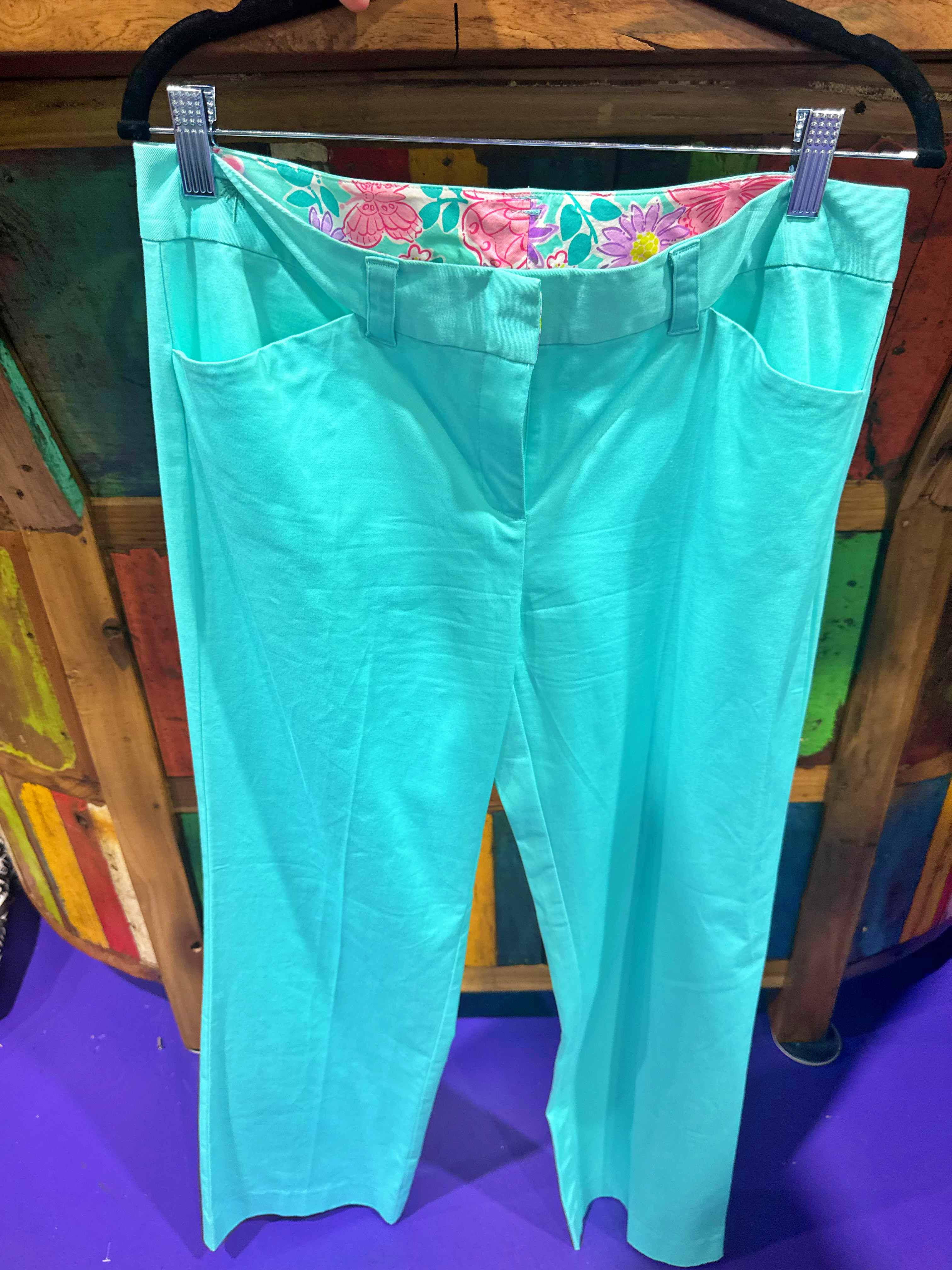 Beautiful turquoise pants with a stylish floral lining..