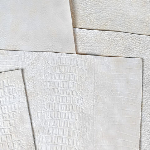 A stack of white Forager hides, a next-gen leather