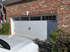 white garage door brick house exterior
