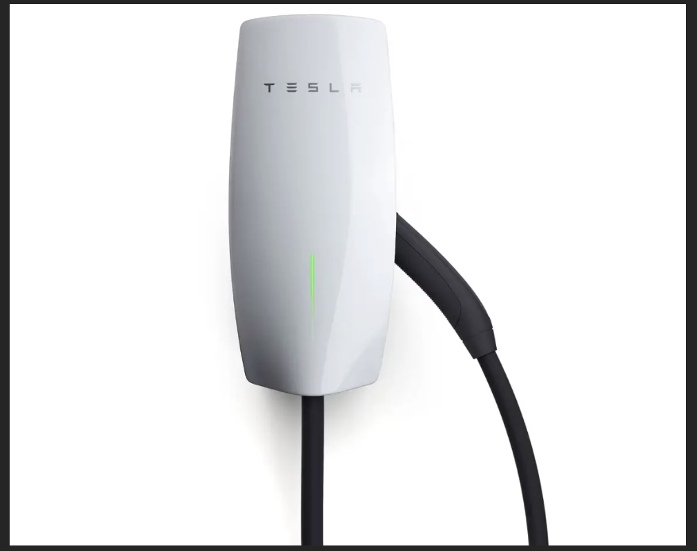 A Tesla Wall Connector installed elegantly on a clean white residential wall.