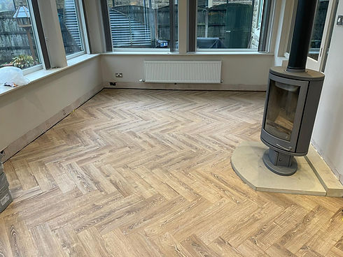 Room with herringbone wooden floor