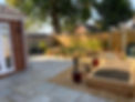 A back garden with block paving