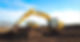 Yellow excavator at work on a dirt site