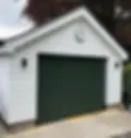 White panelled garage with black roller door