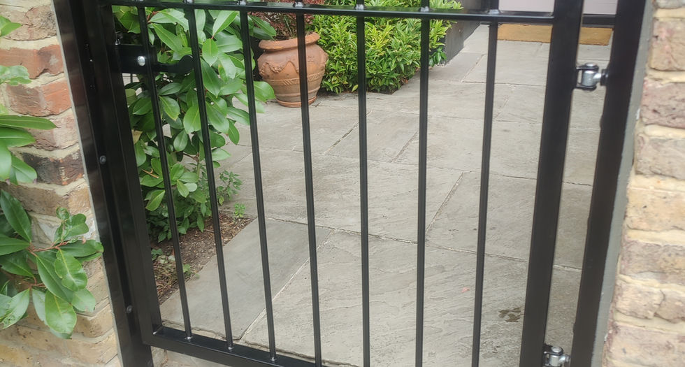 Black metal gate in garden