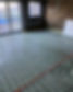 Close-up of a floor heating system showing white tubing arranged in parallel