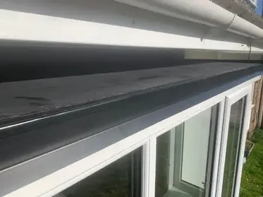 Roof edge with window below