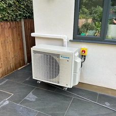 A Daikin air conditioning unit installed on a patio