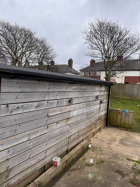 Wooden shed exterior and grass