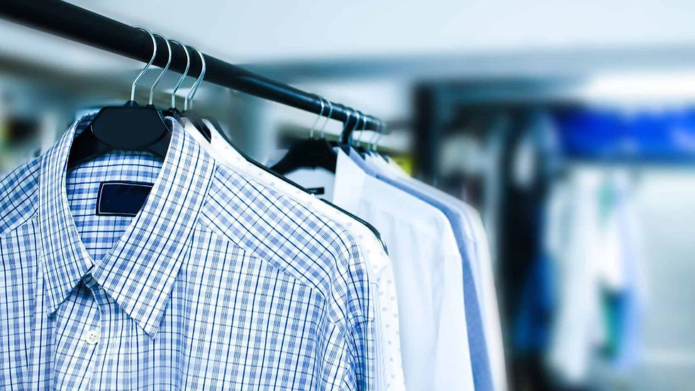 Clothing displayed on hangers inside a retail store