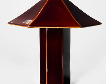 Deep maroon glazed ceramic table lamp with a high-shine finish for sophisticated lounge area accents.