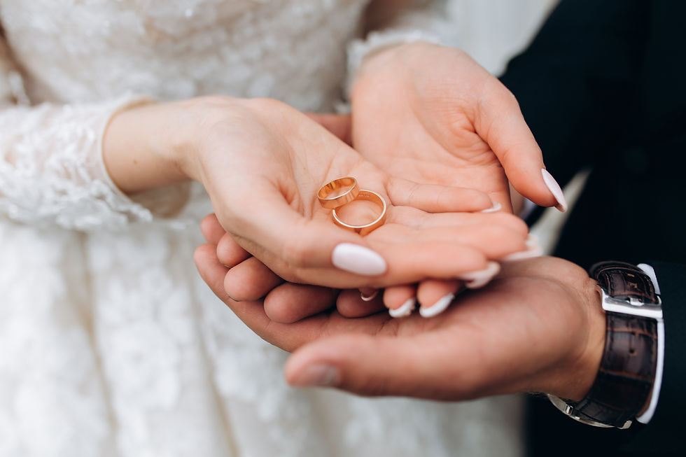 groom-holds-bride-s-hands-where-are-two-wedding-rings