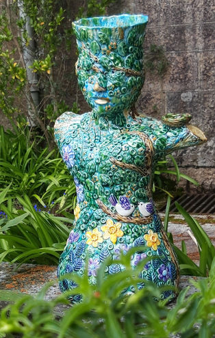 Tree Spirit is the largest piece to date, that i could fit in the kiln.
It has flowers, birds and leaves all around it, also a female form masked as a tree.
Ca 80 cm tall.