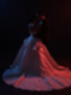 Editorial wedding photo of couple embracing in dramatic light