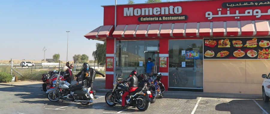 Bikers and Harley motorcycles stopped for a quick snack near the road