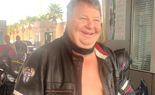Happy biker with leather jacket