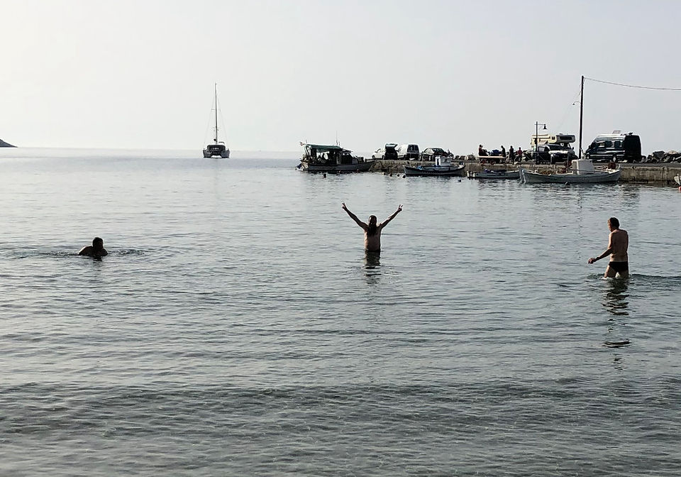 swimming men in the sea