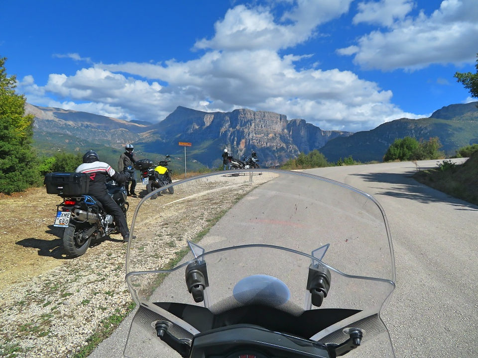 bikers and motorcycles on a mountain road in greece