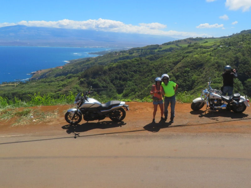 Up in the mountains happy couple of bikers with motorcycles in Hawaii on Peterpanplanet motorcycle tour Aloha Hawaii