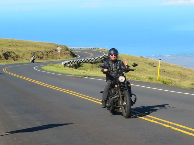 Biker riding Harley in Hawaii Island, ocean view