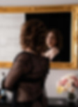 Woman posing by gold mirror during Calgary boudoir photoshoot