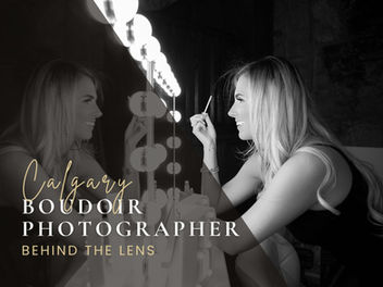 Blonde woman smiling while looking into mirror reflection in black and white with text "Calgary boudoir photographer".