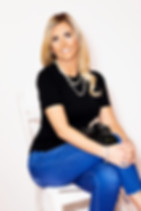 Calgary boudoir photographer headshot with professional camera.