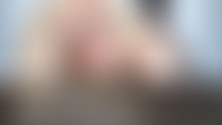 Plus size woman over 50 boudoir portrait with text "50 & Fabulous".