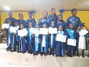 Graduates displaying their Certificates