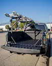 Truck equipped with ladder rack.