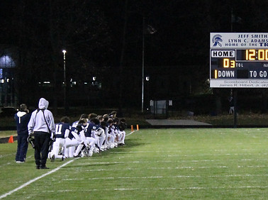 ELHS football team kneels.jpeg