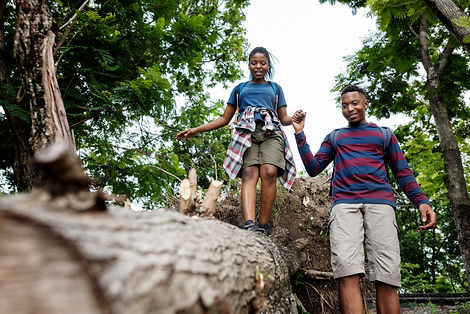 Couple trekking in a forest.jpg